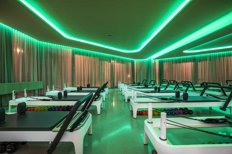 The Joyful Pilates studio bathed in green light